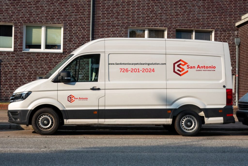 A white van is parked outside a building, indicating a carpet and rug cleaning service based in Jacksonville, FL.